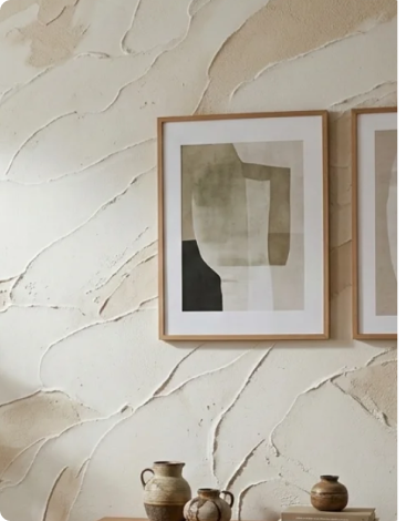 Textured putty wall with framed artwork